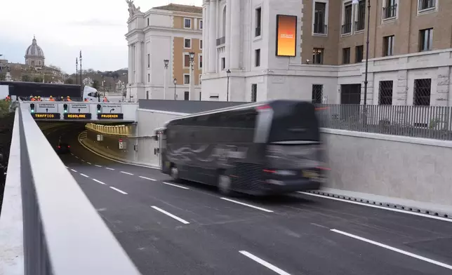 Cars pass into the newly inaugurated tunnel, a day before the start of the 2025 Jubilar year, which allows the main square leading for St. Angelo Castle to the St. Peter's Basilica to be a fully pedestrian area, in Rome, Monday, Dec. 23, 2024. (AP Photo/Gregorio Borgia)