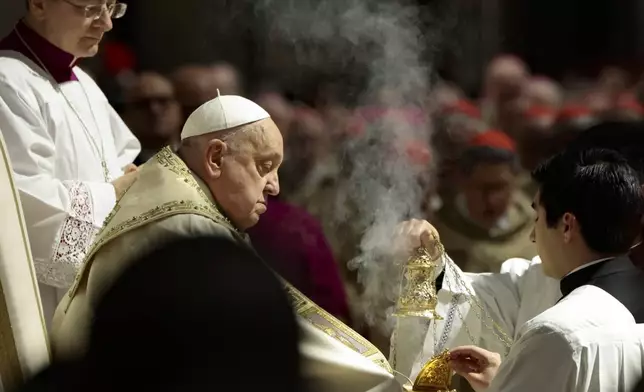 Pope Francis celebrates a Christmas Eve Mass on the day the Pope opens the Holy Door to mark the opening of the 2025 Catholic Holy Year, or Jubilee, in St. Peter's Basilica, at the Vatican, Dec. 24, 2024. (Remo Casilli/Pool Photo via AP)