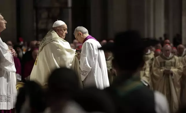 Pope Francis celebrates a Christmas Eve Mass on the day the Pope opens the Holy Door to mark the opening of the 2025 Catholic Holy Year, or Jubilee, in St. Peter's Basilica, at the Vatican, Dec. 24, 2024. (Remo Casilli/Pool Photo via AP)