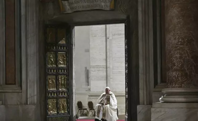 Pope Francis opens the Holy Door of St Peter's Basilica to mark the start of the Catholic Jubilee Year, at the Vatican, Dec. 24, 2024. (Alberto Pizzoli/Pool Photo via AP)