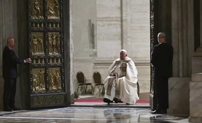 Pope Francis opens the Holy Door of St Peter's Basilica to mark the start of the Catholic Jubilee Year, at the Vatican, Dec. 24, 2024. (Alberto Pizzoli/Pool Photo via AP)