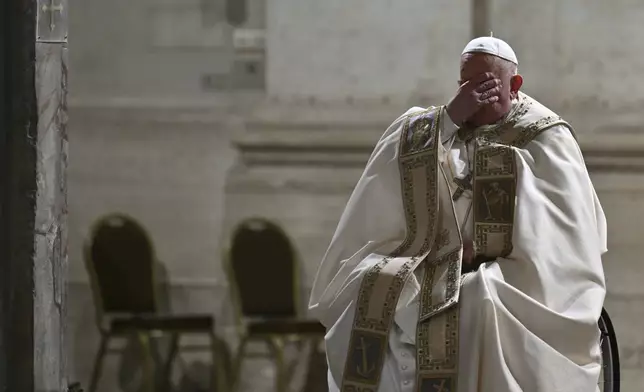 Pope Francis opens the Holy Door of St Peter's Basilica to mark the start of the Catholic Jubilee Year, at the Vatican, Dec. 24, 2024. (Alberto Pizzoli/Pool Photo via AP)