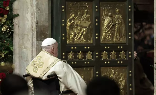 Pope Francis opens the Holy Door to mark the opening of the 2025 Catholic Holy Year, or Jubilee, in St. Peter's Basilica, at the Vatican, Dec. 24, 2024. (Remo Casilli/Pool Photo via AP)