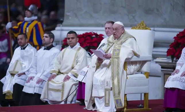 Pope Francis presides over the Christmas Eve Mass in St. Peter's Basilica at The Vatican, Tuesday, Dec. 24, 2024, after opening the basilica's holy door marking the start of the Catholic jubilar year 2025. (AP Photo/Andrew Medichini)