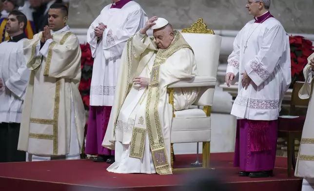 Pope Francis presides over the Christmas Eve Mass in St. Peter's Basilica at The Vatican, Tuesday, Dec. 24, 2024, after opening the basilica's holy door marking the start of the Catholic jubilar year 2025. (AP Photo/Andrew Medichini)