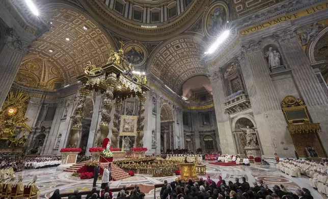 Pope Francis presides over the Christmas Eve Mass in St. Peter's Basilica at The Vatican, Tuesday, Dec. 24, 2024, after opening the basilica's holy door marking the start of the Catholic jubilar year 2025. (AP Photo/Andrew Medichini)