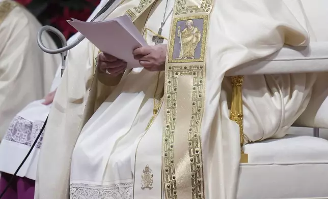 Pope Francis presides over the Christmas Eve Mass in St. Peter's Basilica at The Vatican, Tuesday, Dec. 24, 2024, after opening the basilica's holy door marking the start of the Catholic jubilar year 2025. (AP Photo/Andrew Medichini)