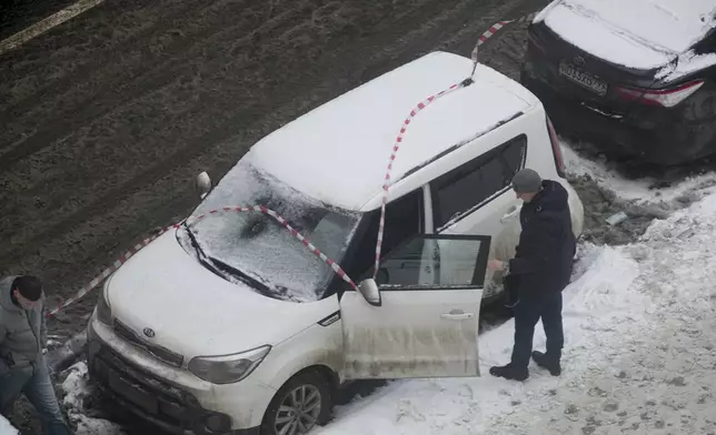 Investigators work at the place where Lt. General Igor Kirillov, the head of Russia's Nuclear, Biological, and Chemical Defence Forces and his assistantIlya Polikarpov were killed by an explosive device planted close to a residential apartment's block in Moscow, Russia, Tuesday, Dec. 17, 2024. (AP Photo)