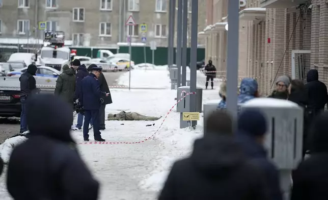 Investigates work at the place where Lt. General Igor Kirillov, the head of Russia's Nuclear, Biological, and Chemical Defence Forces was killed by an explosive device planted close to a residential apartment's block in Moscow, Russia, Tuesday, Dec. 17, 2024. (AP Photo)