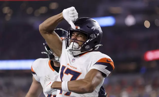 Denver Broncos wide receiver Devaughn Vele (17) celebrates after his touchdown catch during the first half an NFL football game against the Los Angeles Chargers, Thursday, Dec. 19, 2024, in Inglewood, Calif. (AP Photo/Ryan Sun)