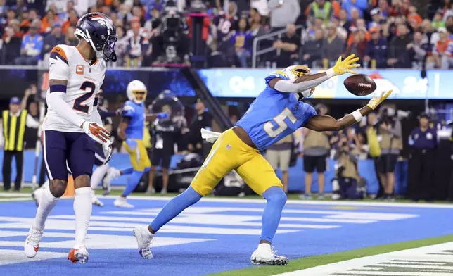 Los Angeles Chargers wide receiver Joshua Palmer (5) catches the ball in the end zone for a two-point conversion during the second half an NFL football game against the Denver Broncos, Thursday, Dec. 19, 2024, in Inglewood, Calif. (AP Photo/Ryan Sun)