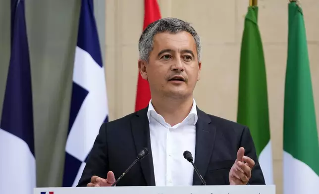 FILE - French Interior minister Gerald Darmanin acknowledges members of foreign police forces that help with the security of the 2024 Summer Olympics, Thursday, July 25, 2024, in Paris, France. (AP Photo/Petr David Josek, File)