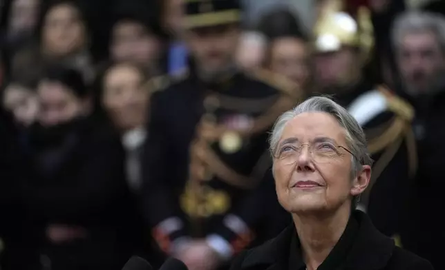 FILE - Outgoing French Prime Minister Elisabeth Borne looks up after the handover ceremony, Tuesday, Jan. 9, 2024 in Paris. (AP Photo/Thibault Camus, File)