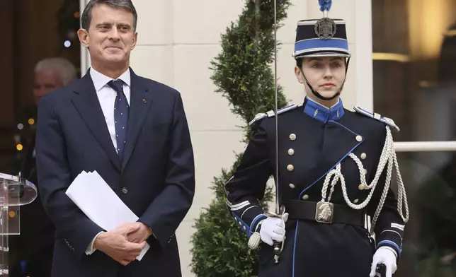 Newly named Minister for Overseas Affairs Emmanuel Valls looks on after the hand over ceremony, in Paris, Tuesday, Dec. 24, 2024. (AP Photo/Thomas Padilla)