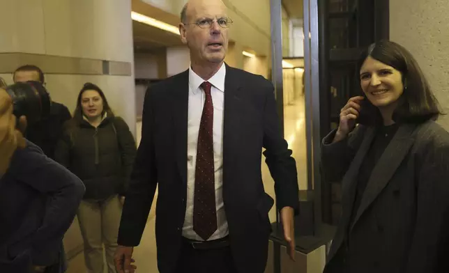 Newly named finance minister Eric Lombard leaves after the handover ceremony Monday, Dec. 23, 2024 in Paris. (AP Photo/Thomas Padilla)