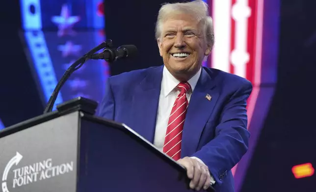 President-elect Donald Trump speaks at AmericaFest, Sunday, Dec. 22, 2024, in Phoenix. (AP Photo/Rick Scuteri)