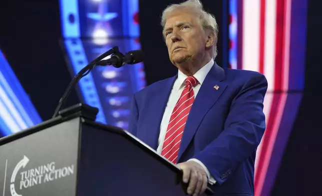 President-elect Donald Trump speaks at AmericaFest, Sunday, Dec. 22, 2024, in Phoenix. (AP Photo/Rick Scuteri)