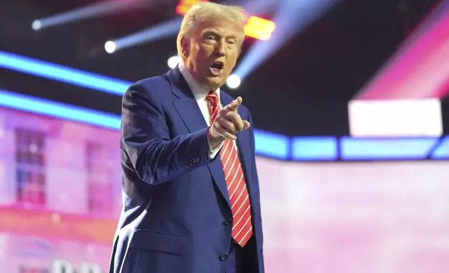 President-elect Donald Trump speaks at AmericaFest, Sunday, Dec. 22, 2024, in Phoenix. (AP Photo/Rick Scuteri)