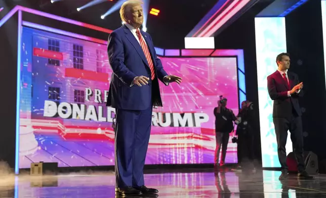 President-elect Donald Trump arrives to speak at AmericaFest, Sunday, Dec. 22, 2024, in Phoenix. (AP Photo/Rick Scuteri)