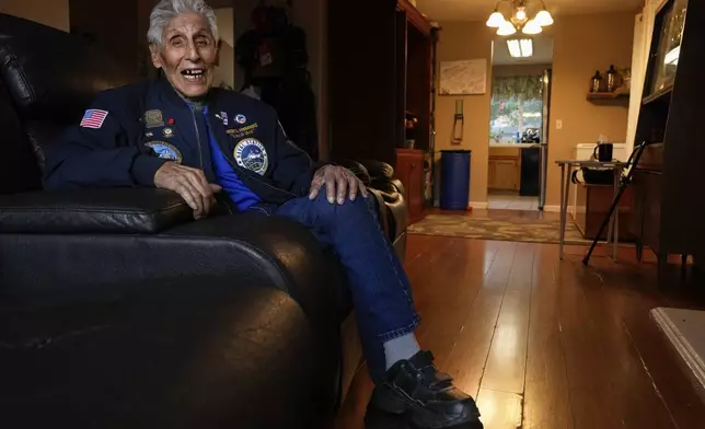 Pearl Harbor Navy veteran Bob Fernandez smiles while being photographed at home Tuesday, Nov. 19, 2024, in Lodi, Calif. (AP Photo/Godofredo A. Vásquez)