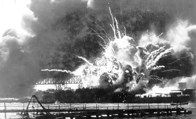 FILE - In this photo provided by the U.S. Navy, the destroyer USS Shaw explodes after being hit by bombs during the Japanese attack on Pearl Harbor, Hawaii, Dec. 7, 1941. (U.S. Navy via AP, File)