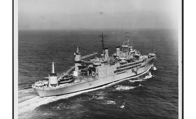 The USS Curtiss is seen underway at sea, 1954. (Naval History and Heritage Command via AP)