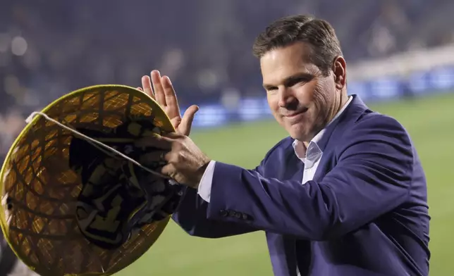 Los Angeles Galaxy head coach Greg Vanney celebrates after a win over the Seattle Sounders in an MLS Western Conference final soccer match, Saturday, Nov. 30, 2024, in Carson, Calif. (AP Photo/Etienne Laurent)