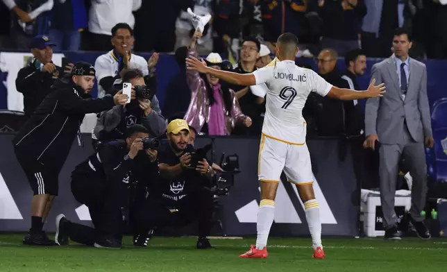 Los Angeles Galaxy forward Dejan Joveljic celebrates after scoring during the second half of an MLS Western Conference final soccer match against the Seattle Sounders, Saturday, Nov. 30, 2024, in Carson, Calif. (AP Photo/Etienne Laurent)