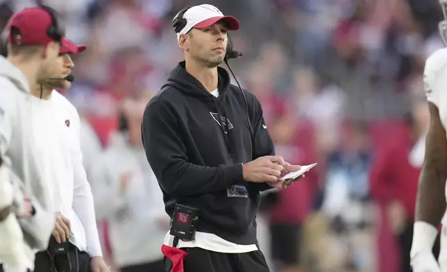 Arizona Cardinals head coach Jonathan Gannon watches during the second half of an NFL football game against the New England Patriots, Sunday, Dec. 15, 2024, in Glendale, Ariz. (AP Photo/Ross D. Franklin)