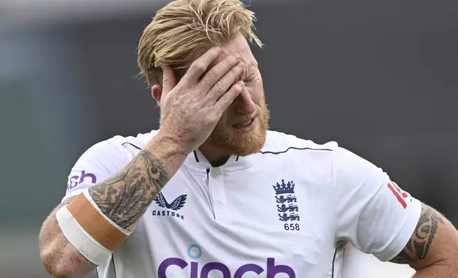 England captain Ben Stokes reacts as he leaves the field with an injury during play on day three of the third cricket test between England and New Zealand in Hamilton, New Zealand, Monday, Dec. 16, 2024. (Andrew Cornaga/Photosport via AP)