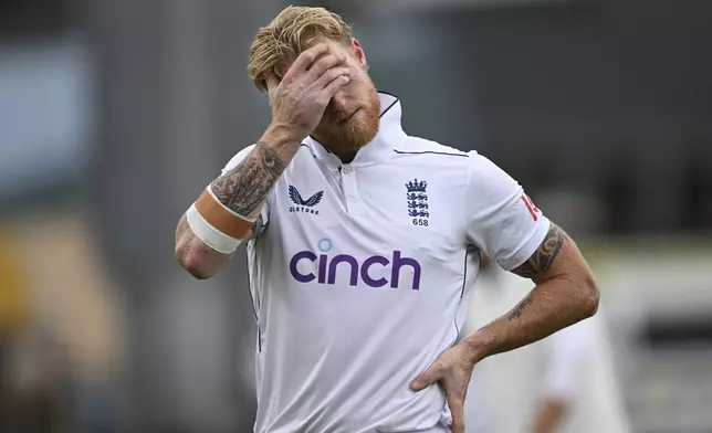 England captain Ben Stokes reacts as he leaves the field with an injury during play on day three of the third cricket test between England and New Zealand in Hamilton, New Zealand, Monday, Dec. 16, 2024. (Andrew Cornaga/Photosport via AP)