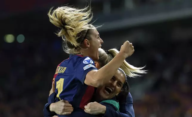 Barcelona's Alexia Putellas celebrates after scoring her side's third goal during the women's Champions League group D soccer match between FC Barcelona and Manchester City at the Olympic Stadium in Barcelona, Spain, Wednesday, Dec. 18, 2024. (AP Photo/Joan Monfort)