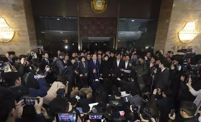 South Korea's main opposition Democratic Party leader Lee Jae-myung, top center, speaks at the National Assembly in Seoul, South Korea, Wednesday, Dec. 4, 2024. (Kim Ju-hyung/Yonhap via AP)