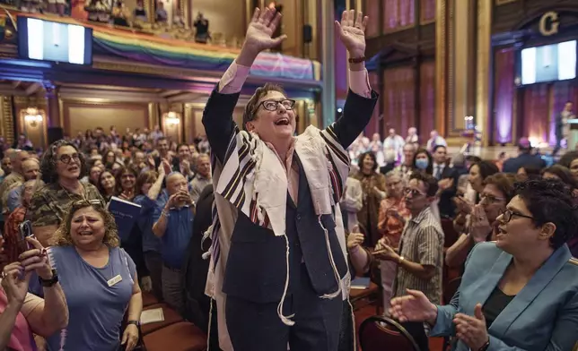 Rabbi Sharon Kleinbaum sings during her last service at the Masonic Hall, Friday, June 28, 2024, in New York. After leading the nation's largest LGBTQ+ synagogue through the myriad ups and downs of the modern gay-rights movement for the last three decades, she is now stepping down from that role and shifting into retirement. The synagogue that she led for 32 years — Congregation Beit Simchat Torah in midtown Manhattan — will have to grapple with its identity after being defined by its celebrity rabbi for so long. (AP Photo/Andres Kudacki)