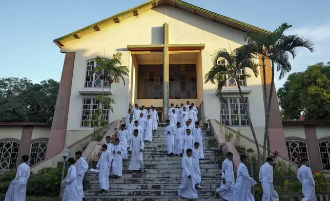 Seminarians leave after morning Mass at Ritapiret Major Seminary in Maumere, East NusaTenggara province, Indonesia, Friday, Aug. 23, 2024. (AP Photo/Tatan Syuflana)