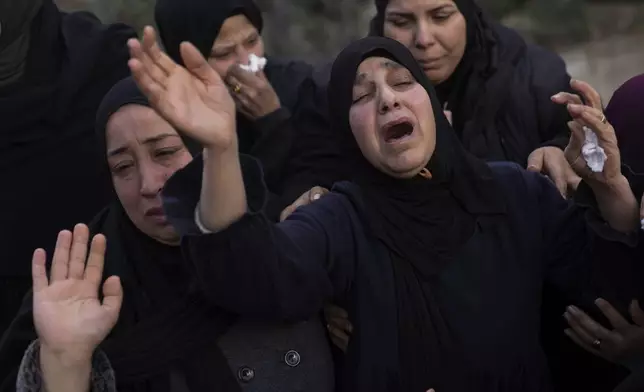 Relatives mourn the death of Palestinian Shatha al-Sabbagh, a 22-year-old journalism student, during her funeral in the Jenin refugee camp in the Israeli-occupied West Bank, Sunday, Dec. 29, 2024. (AP Photo/Majdi Mohammed)