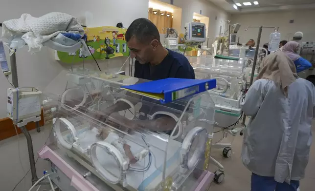 Ali al-Batran, a 20-day-old infant, lies in the intensive care unit with hypothermia at Al-Aqsa Martyrs Hospital in Deir al-Balah, central Gaza, Sunday, Dec. 29, 2024. His twin brother, Jomaa, has died, as local health officials report at least three other infant deaths from the cold in recent weeks. (AP Photo/Abdel Kareem Hana)