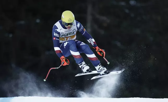 United States' Ryan Cochran Siegle speeds down the course during an alpine ski, men's World Cup downhill, in Val Gardena, Italy, Saturday, Dec. 21, 2024. (AP Photo/Gabriele Facciotti)