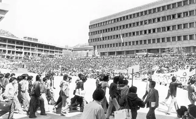 FILE- Some 10,000 students of Seoul National University hold a campus rally on Friday, May 2, 1980 to demand the lifting of martial law and the resignation of Premier Shin Hyon-Hwack and Korean Central Intelligence Chief Lt. Gen. Chin Doc-Hwan. (AP Photo/Kim Chon Kil, File)