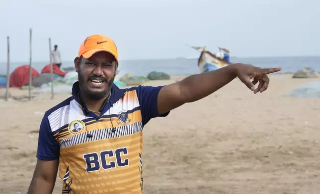 Yusuf Ansari, now a 32-year-old motor rickshaw driver narrates the incident standing on the same when the tsunami hits the shore in 2004, in Chennai,India, Friday, Dec. 20, 2024. "Out of nowhere, we saw a boat tossed by the waves, followed by a massive rush of dark water and a big wave of water. It all happened so fast. Everyone around panicked. They didn't even think about their boats or homes," Ansari said, adding that everyone just ran to higher ground as quickly as possible. (AP Photo/Mahesh Kumar A.)