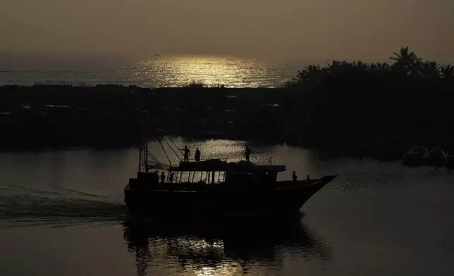 Fishermen get ready to launch their boat for fishing in Nagapattinam, one of the severely damaged town during 2004 tsunami, India, Sunday, Dec. 15, 2024. (AP Photo/Mahesh Kumar A.)