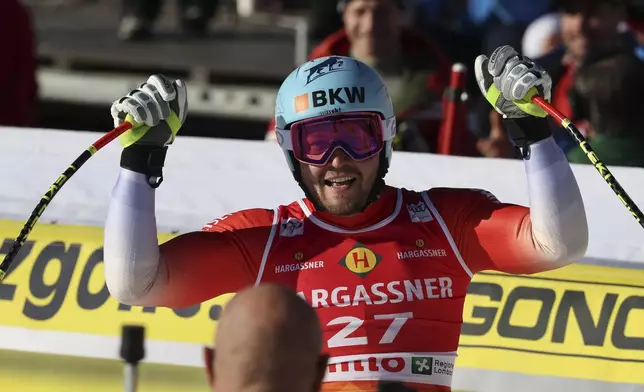 Switzerland's Alexis Monney reacts after completing an alpine ski, men's World Cup Super G race, in Bormio, Italy, Sunday, Dec. 29, 2024. (AP Photo/Marco Trovati)