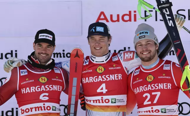 From left, second placed Austria's Vincent Kriechmayr, the winner Norway's Fredrik Moeller, and third placed Switzerland's Alexis Monney celebrate after an alpine ski, men's World Cup Super G race, in Bormio, Italy, Sunday, Dec. 29, 2024. (AP Photo/Marco Trovati)