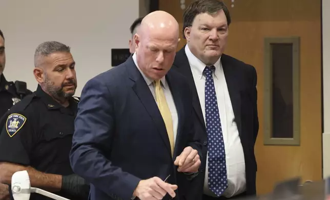 Rex A. Heuermann stands with his lawyer Michael Brown during a court hearing where he was charged with killing Valerie Mack, inside Supreme Court Justice Timothy Mazzei's courtroom at Suffolk County Court in Riverhead, N.Y. on Tuesday, Dec. 17, 2024. (James Carbone/Newsday via AP, Pool)