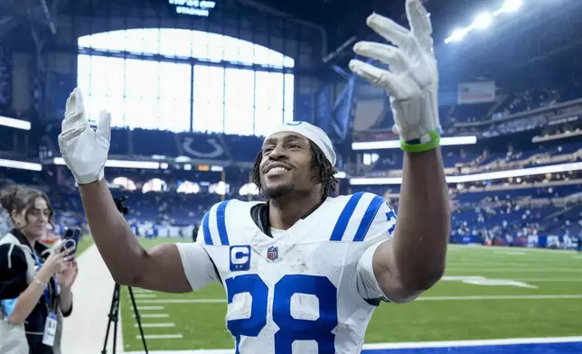 Indianapolis Colts running back Jonathan Taylor (28) celebrates the team's win against the Tennessee Titans after an NFL football game Sunday, Dec. 22, 2024, in Indianapolis. (AP Photo/Michael Conroy)