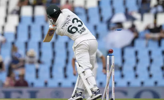 Pakistan's Saim Ayub is bowled out by South Africa's Kagiso Rabada, for 27 runs during day two of the Test cricket match between South Africa and Pakistan, at the Centurion Park in Centurion, South Africa, Friday, Dec. 27, 2024. (AP Photo/Themba Hadebe)