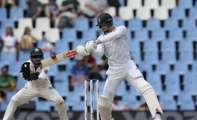 South Africa's Corbin Bosch, right, plays a shot whilst Pakistan's Mohammad Rizwan watches on during day two of the Test cricket match between South Africa and Pakistan, at the Centurion Park in Centurion, South Africa, Friday, Dec. 27, 2024. (AP Photo/Themba Hadebe)