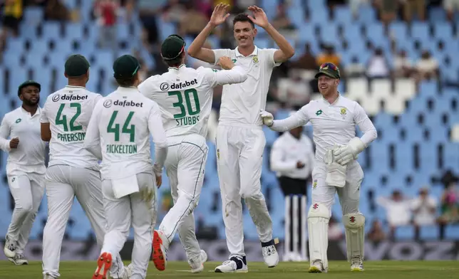 South Africa's Marco Jansen, second right, celebrates with his teammates after taking a wicket of Shan Masood for 28 runs during day two of the Test cricket match between South Africa and Pakistan, at the Centurion Park in Centurion, South Africa, Friday, Dec. 27, 2024. (AP Photo/Themba Hadebe)