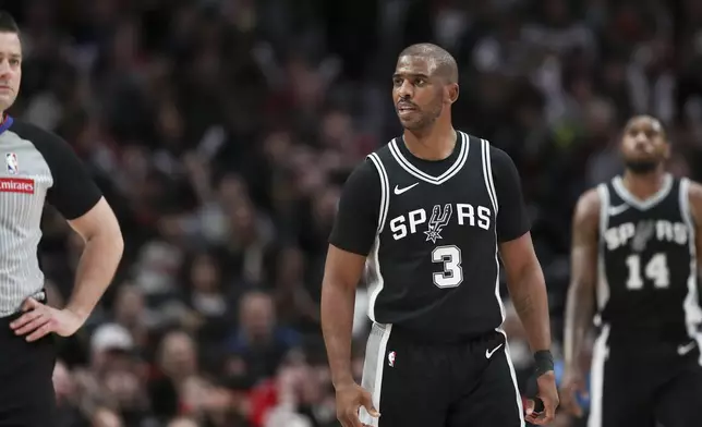 San Antonio Spurs guard Chris Paul (3) reacts to a call during the first half of an NBA basketball game against the Portland Trail Blazers Friday, Dec. 13, 2024, in Portland, Ore. (AP Photo/Amanda Loman)