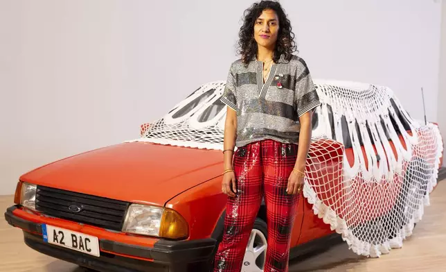 Jasleen Kaur is announced as the winner of the Turner Prize 2024 at Tate Britain, in London, Tuesday, Dec. 3, 2024. (David Parry/PA via AP)